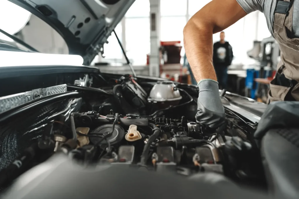 close-up-of-mechanic-s-hands-repairing-car-engine-2026-03-23-23-51-21-utc (1)